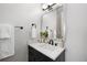 Stylish powder room featuring a modern vanity, elegant faucet, and decorative accents at 4625 W 50Th Ave # 304, Denver, CO 80212