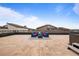 Large rooftop terrace features blue outdoor seating, a hot tub, and expansive views of the surrounding area at 4625 W 50Th Ave # 304, Denver, CO 80212