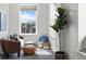 Cozy sitting area nook with natural light showcasing a comfortable armchair and decorative accents at 4625 W 50Th Ave # 304, Denver, CO 80212