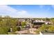 Scenic street view showcasing a blend of residential and commercial buildings amidst lush greenery at 4625 W 50Th Ave # 304, Denver, CO 80212