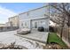 Fenced backyard featuring a patio, artificial turf, and neighbor views at 12366 Nate Cir, Parker, CO 80134