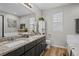 Bright bathroom features a double vanity, granite countertops, and stylish decor at 12366 Nate Cir, Parker, CO 80134