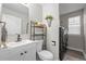 Half bath with a modern vanity, stylish fixtures, and convenient laundry area at 12366 Nate Cir, Parker, CO 80134