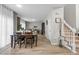 Bright dining room with wood floors and modern table set, perfect for Gathering meals and gatherings at 12366 Nate Cir, Parker, CO 80134