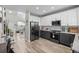 Open concept kitchen with stainless steel appliances and a large island at 12366 Nate Cir, Parker, CO 80134
