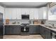 Modern kitchen featuring stainless steel appliances, granite countertops, and a gas range at 12366 Nate Cir, Parker, CO 80134