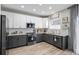 Updated kitchen featuring stainless steel appliances, and two-tone cabinetry at 12366 Nate Cir, Parker, CO 80134