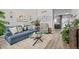 Bright living room features a plush rug, comfortable seating, and modern decor at 12366 Nate Cir, Parker, CO 80134