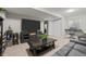 Spacious living room featuring plush seating, a large TV, and an entertainment center at 12366 Nate Cir, Parker, CO 80134