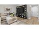 Cozy living room features a large entertainment center, plush seating, and modern decor at 12366 Nate Cir, Parker, CO 80134