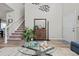 Inviting living room with high ceilings, lots of decor, and a staircase at 12366 Nate Cir, Parker, CO 80134