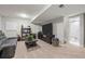 Finished basement living room with plush seating, entertainment center and full bath access at 12366 Nate Cir, Parker, CO 80134