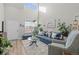 Bright living room features a plush rug, comfortable seating, and lots of natural light at 12366 Nate Cir, Parker, CO 80134