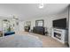 Large main bedroom with a fireplace, dark wood furniture, and ample closet space at 12366 Nate Cir, Parker, CO 80134