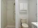 Bathroom features a toilet, shower, medicine cabinet and built-in storage unit at 7552 Garland St, Arvada, CO 80005