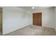 Neutral carpeted bedroom offers closet space and view to hall at 7552 Garland St, Arvada, CO 80005