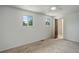 Bright bedroom with two windows and fresh neutral paint at 7552 Garland St, Arvada, CO 80005