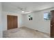 A cozy bedroom featuring a ceiling fan, windows and large closet at 7552 Garland St, Arvada, CO 80005
