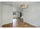 This dining room features bright natural light and beautiful wood floors at 7552 Garland St, Arvada, CO 80005