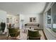 Comfortable living room with lots of light next to dining area with view to outside at 7552 Garland St, Arvada, CO 80005