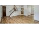 Bright living room features beautiful wood floors and stairs leading to the second level at 7552 Garland St, Arvada, CO 80005