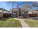 Charming single-story home showcasing a quaint entrance, well-kept lawn, and inviting curb appeal at 3709 Ames St, Wheat Ridge, CO 80212