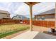 A well-maintained backyard features a patio, fence, and lush grassy area at 467 S 36Th Ave, Brighton, CO 80601