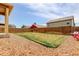 A spacious backyard has a grassy lawn and rock landscaping at 467 S 36Th Ave, Brighton, CO 80601