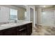 Bathroom featuring double vanity, large mirror, and glass enclosed shower at 467 S 36Th Ave, Brighton, CO 80601