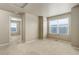Bedroom featuring neutral walls, carpet, and a bright window with horizontal blinds at 467 S 36Th Ave, Brighton, CO 80601
