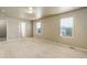 Bedroom featuring neutral carpet, walls, and two windows allowing natural light at 467 S 36Th Ave, Brighton, CO 80601