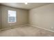 Bedroom featuring neutral walls, carpet, and a bright window with horizontal blinds at 467 S 36Th Ave, Brighton, CO 80601