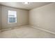 Bedroom featuring neutral walls, carpet, and a bright window with horizontal blinds at 467 S 36Th Ave, Brighton, CO 80601