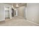 Bright hallway featuring neutral walls, carpet, and multiple doorways leading to various rooms at 467 S 36Th Ave, Brighton, CO 80601