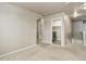 Hallway with neutral walls, carpet, and a laundry closet with washer and dryer at 467 S 36Th Ave, Brighton, CO 80601
