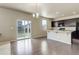 Bright kitchen with sliding glass doors leading to backyard and breakfast bar at 467 S 36Th Ave, Brighton, CO 80601