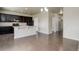 Open kitchen with dark cabinets, stainless steel appliances, and breakfast bar at 467 S 36Th Ave, Brighton, CO 80601
