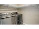 Laundry room with modern washer and dryer and built in shelving at 467 S 36Th Ave, Brighton, CO 80601