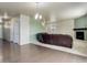 Spacious living room with hardwood floors, fireplace, and comfortable leather sofa at 467 S 36Th Ave, Brighton, CO 80601