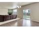 Living room with fireplace, sliding glass doors to backyard, and hardwood floors at 467 S 36Th Ave, Brighton, CO 80601