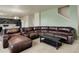 Open concept living room and kitchen area with comfortable leather seating at 467 S 36Th Ave, Brighton, CO 80601