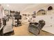 Finished basement featuring carpeted floors, a TV, kitchenette area, Denver Nuggets decor and treadmill at 11746 Elizabeth Cir, Thornton, CO 80233