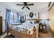 Charming bedroom features blue accents and a four-post bed with a floral comforter at 11746 Elizabeth Cir, Thornton, CO 80233