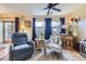Bright living room with hardwood floors, comfortable seating, and an inviting atmosphere at 11746 Elizabeth Cir, Thornton, CO 80233