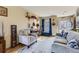 Bright living room featuring hardwood floors, neutral walls, and a comfortable seating area at 11746 Elizabeth Cir, Thornton, CO 80233