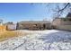 This property boasts a spacious backyard, complete with a wooden deck and ample room for recreation and relaxation at 6393 S Johnson St, Littleton, CO 80123