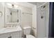 Clean and modern bathroom with tiled shower, marble countertop, and stylish fixtures at 6393 S Johnson St, Littleton, CO 80123