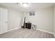 Cozy bedroom with wood-look floors, a black dresser, and a full length mirror at 6393 S Johnson St, Littleton, CO 80123