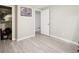 Bright bedroom with closet, wood-look floors, fresh paint, and ample natural light at 6393 S Johnson St, Littleton, CO 80123