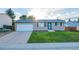 Charming ranch style home with well-maintained lawn, attached garage and inviting curb appeal at 6393 S Johnson St, Littleton, CO 80123